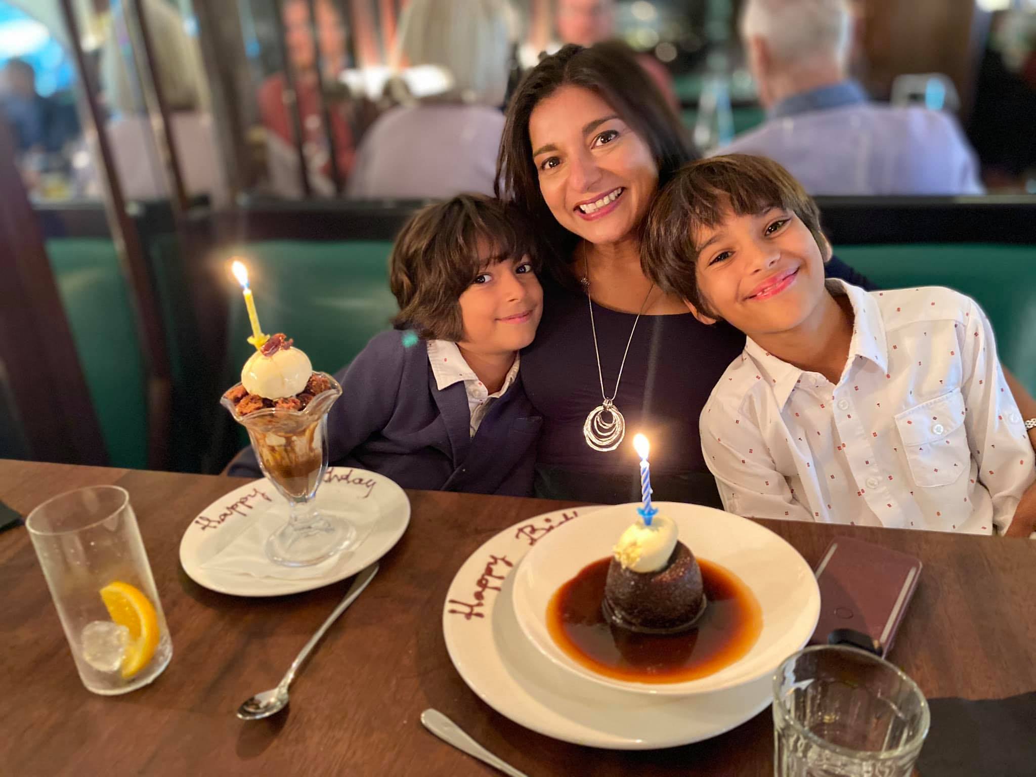Sapna at restaurant for 50th birthday with her boys